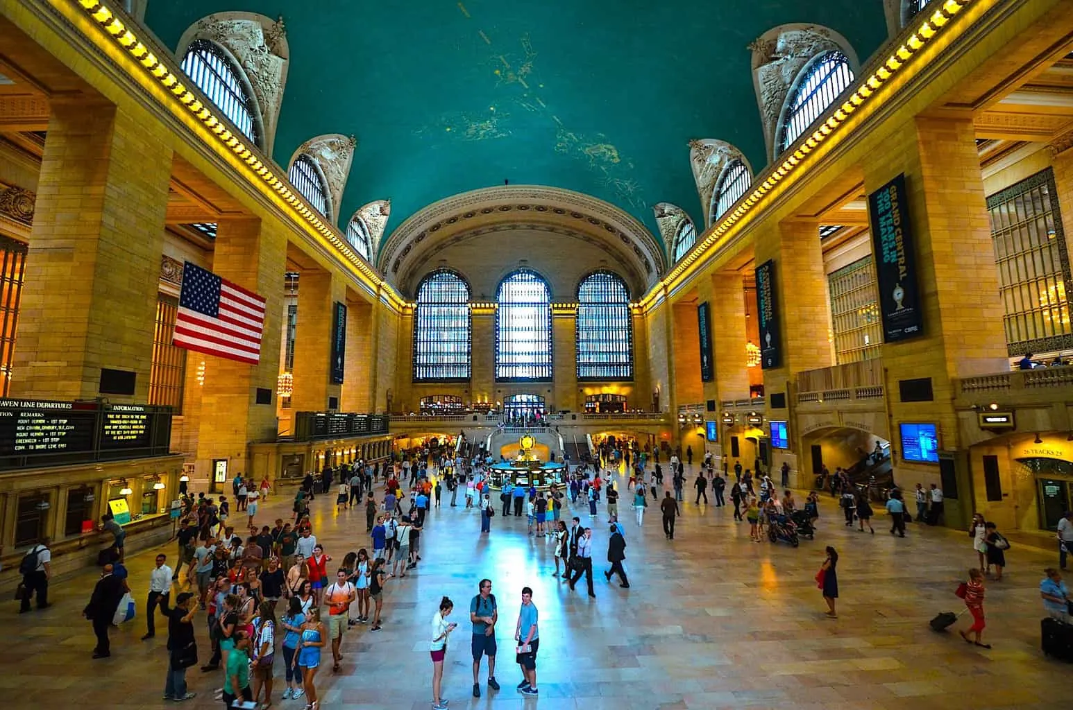The expansive interior of Grand Central terminal with its central clock and constellation embued ceiling. 