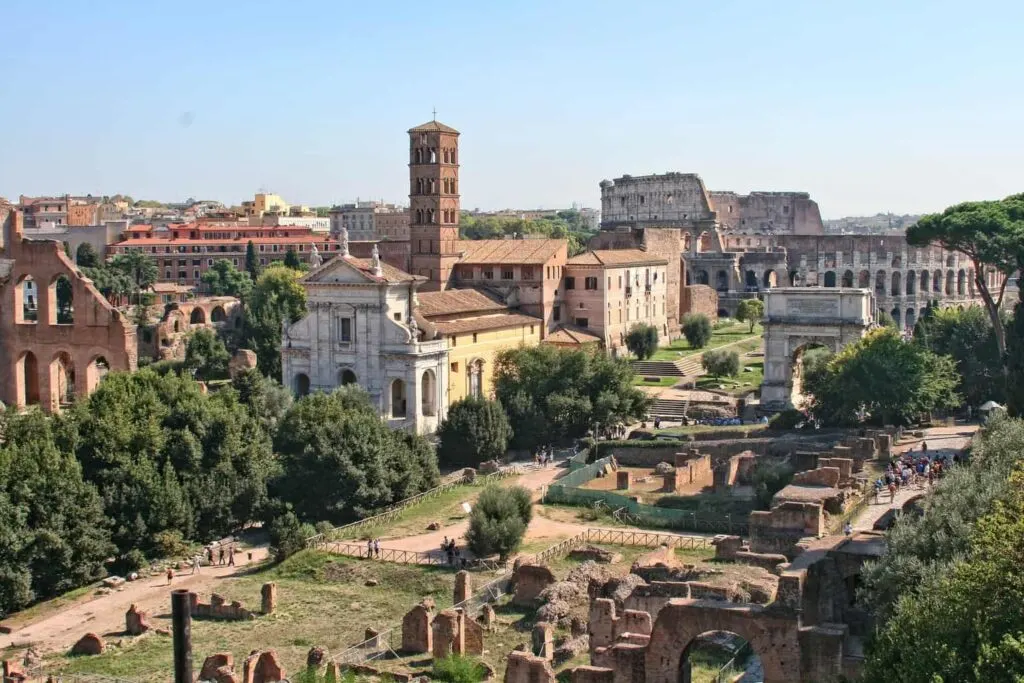 An aerial view of the ancient buildings that make up the Roman Forum in Rone. It's one of the best things to do in Rome alone. 