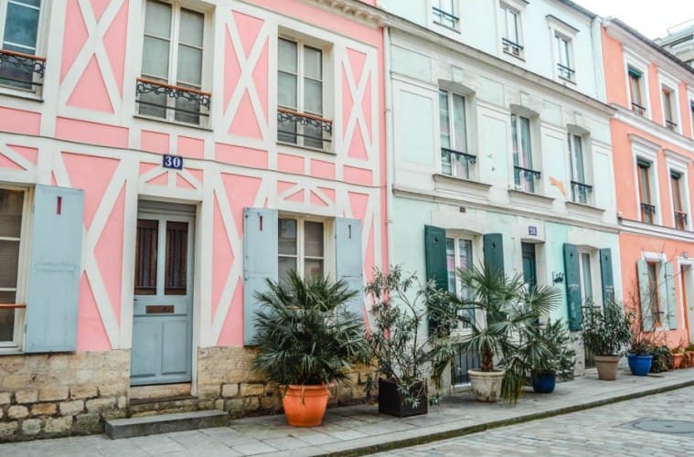 Some of the vibrant, pastel-hued homes that you'll find along Rue Crémieux.
