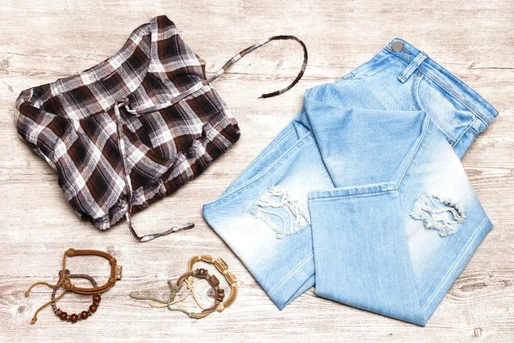 Trendy jeans and checked t-shirt are just a few examples of cool clothes from Vintage Thrift Shop which is one of the best places to shop in NYC on a budget