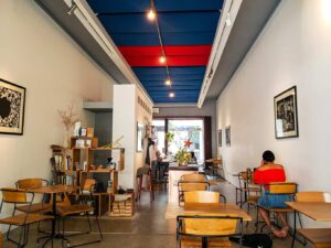 The sleek, modern interior of The Red Door Cafe in Ho Chi Minh, Vietnam.