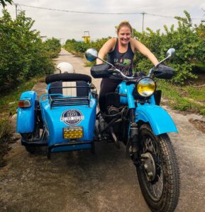 If you're gonna visit Bat Trang Ceramics Village, then why not do it in style and ride in this vintage, motorcycle with Vietnam Retro Tours? And while you can't actually drive the motorcycle yourself, you can take a sweet, sweet photo like this one!