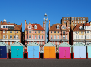 Some of the colorful bathhouses that you'll find along the beaches of Brighton, England!