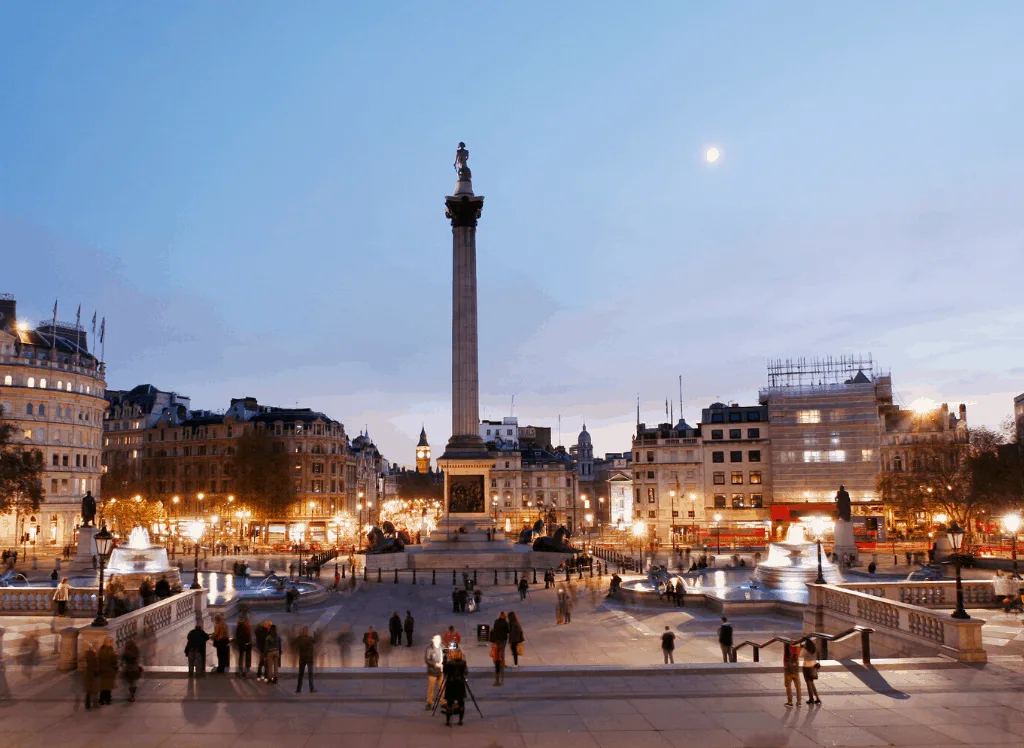 Trafalgar Square in the evening during your London itinerary.