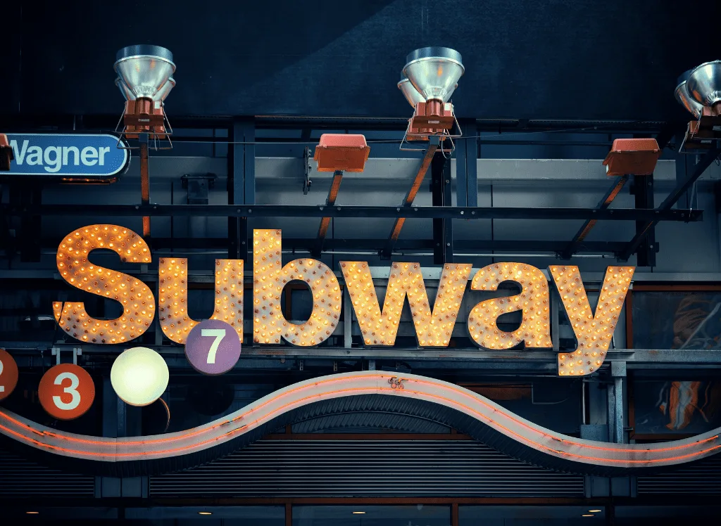 A subway sign since the subway in a great way to travel NYC on a budget. 