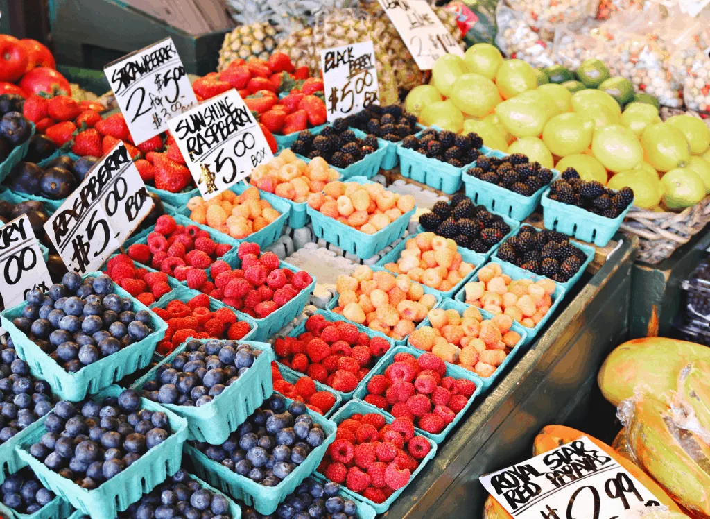 Farmer's market with fresh fruit including blueberries, raspberries, papayas and more. It is one of the cool things to do in Toronto.