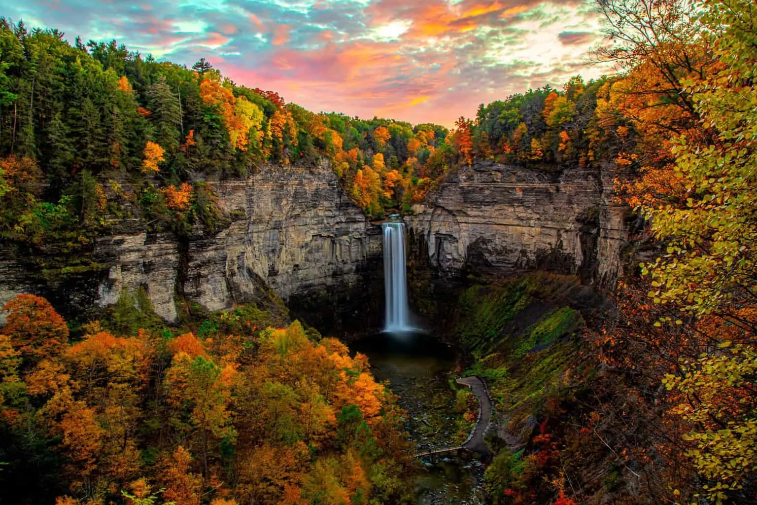  Beautiful Taughannock Falls surrounded by fall foliage near Ithaca, NY, in the Finger Lakes region. 