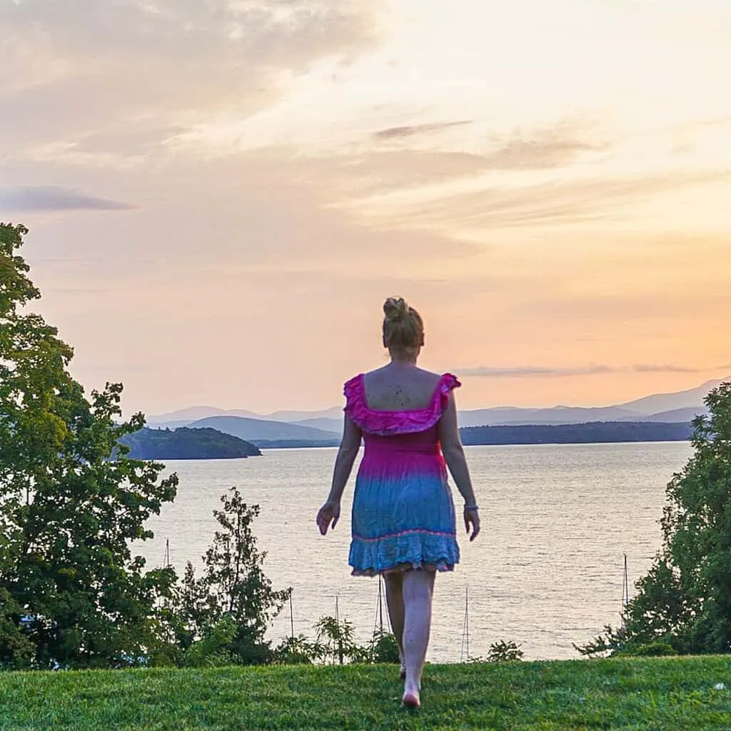 View of me standing in front of lake Champlain with my back to the camera at sunrise. 