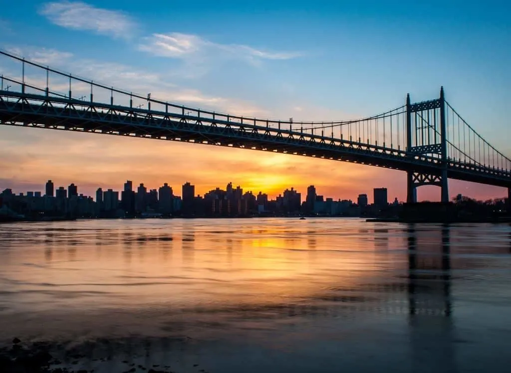 A view of the Robert F. Kennedy Bridge at sunset from Astoria Park in Queens. 