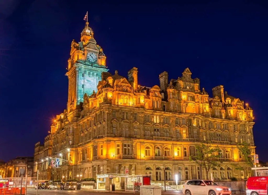The beautiful Balmoral Hotel all lit up in the evening in Edinburgh. 