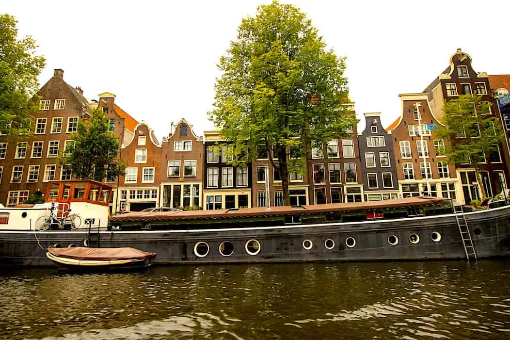 Houses line Oude Waal which sits along a canal in Amsterdam. 
