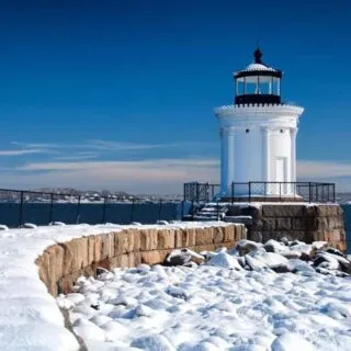 Portland Breakwater Lighthouse covered in snow.