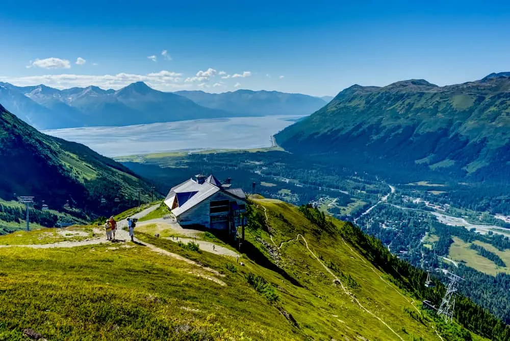 View towards and from Mount Alyeska with people and house overlook near Girdwood Alaska