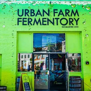 The bright green exterior of Urban Farm Fermentory in Portland Maine.