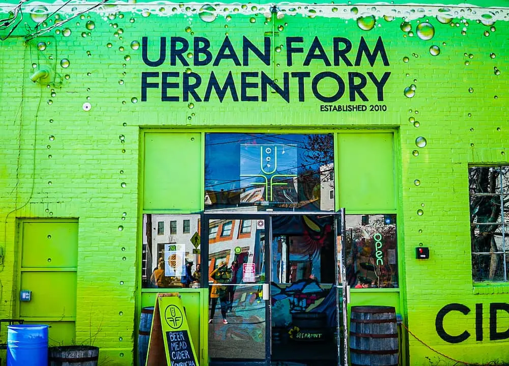 The bright green exterior of Urban Farm Fermentory in Portland Maine.