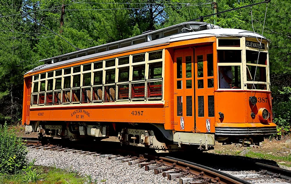 An orange, Eastern Massachusetts Street Railway car from 1918 at Seashore Trolley Museum. 