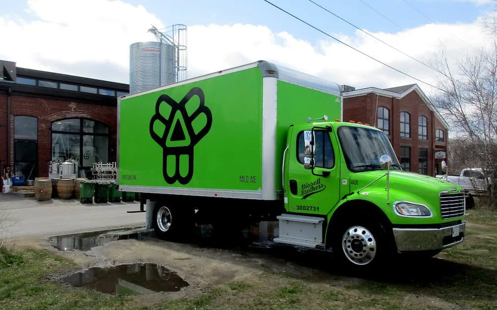Lime green Bissell Brothers Brewing Company delivery truck. 
