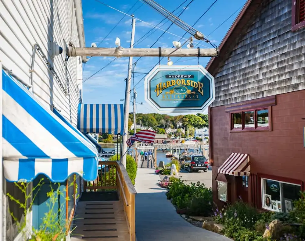 Storefronts and shop signs in Boothbay Harbor Maine. 