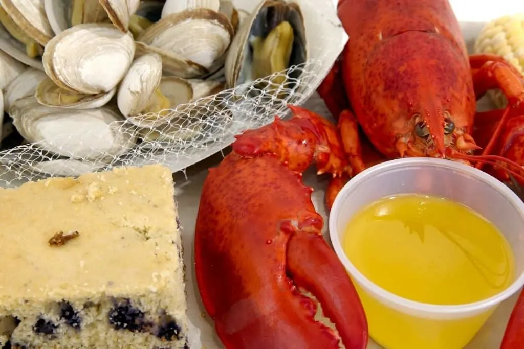 Blueberry cake, lobster, clams, and melted butter from a New England Clam Bake. 