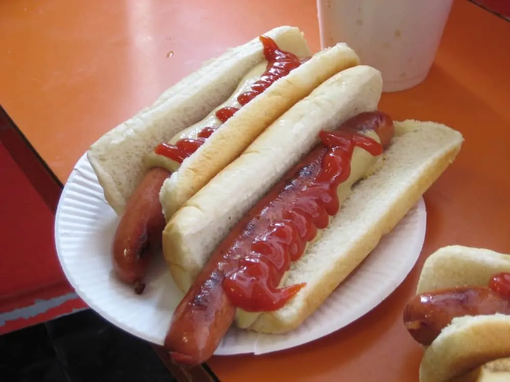 Two hot dogs with mustard and ketchup from Gray's Papaya in NYC.