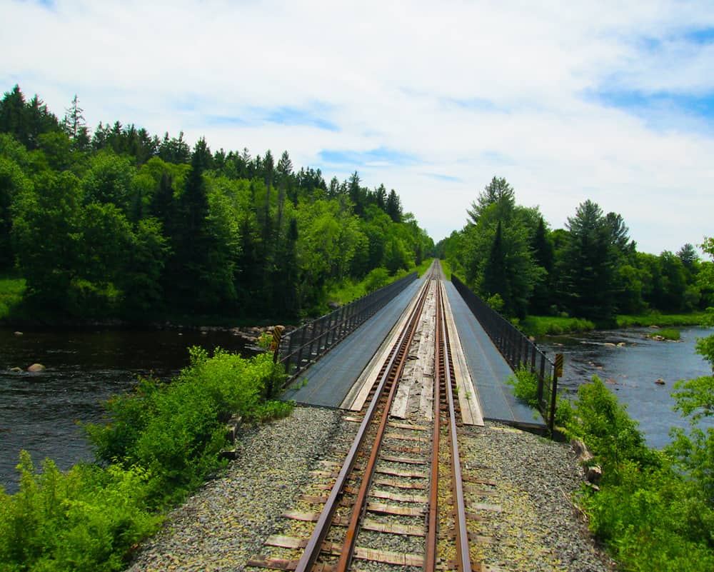 Railway tracks through The Adirondack Park at Old Forge while aboard the Adirondack Scenic Railway. 