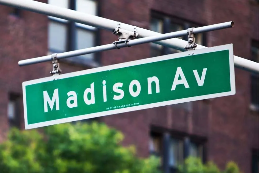 Green street sign for Madison Avenue in NYC