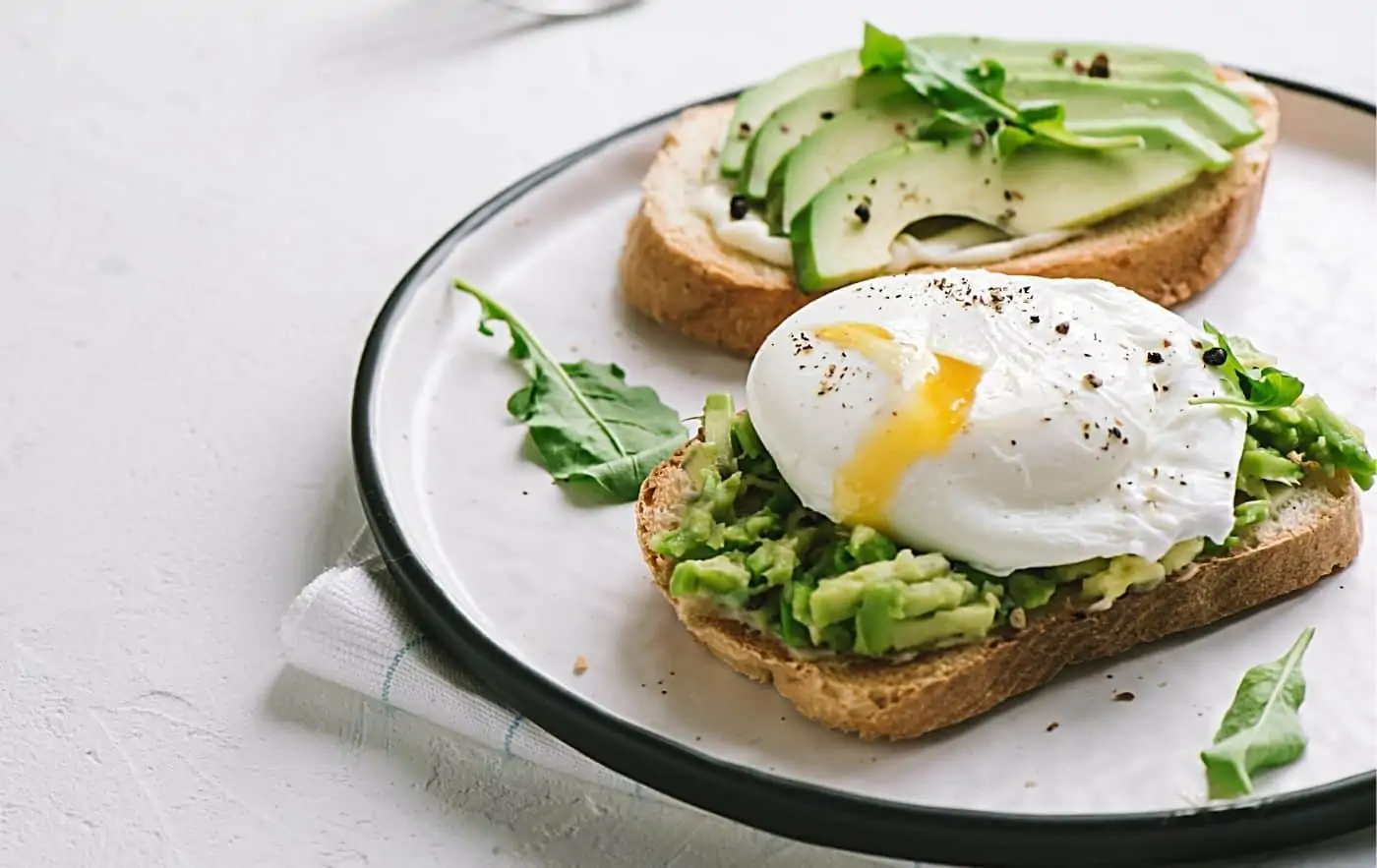 Avocado on toast with a poached egg on top Is the best brunch in Paris