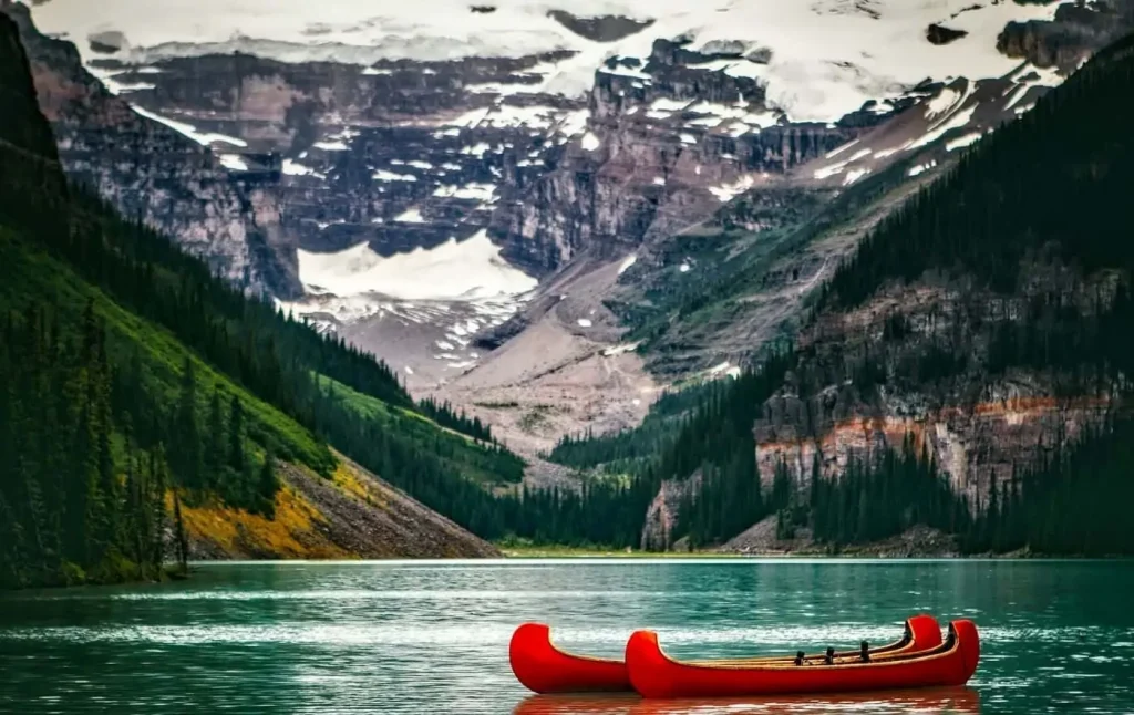red boats floating on a lake in canada
