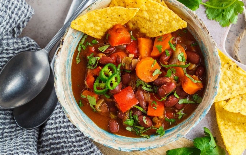 Vegan Mexican cuisine with tortilla chips and inside a bowl. 