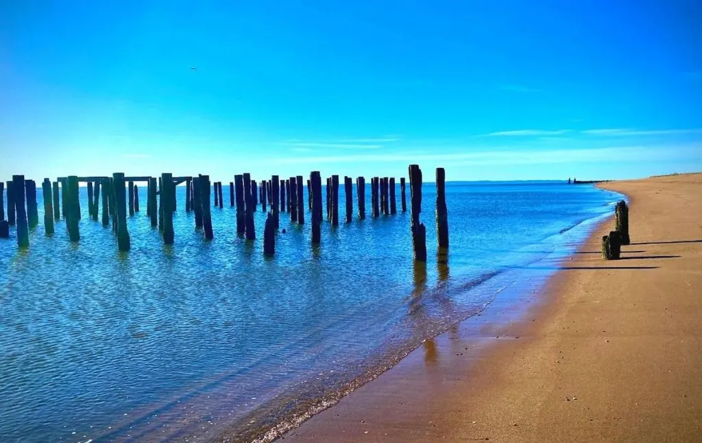 Old pillars in the water at south beach, one of the best beaches Staten Island.