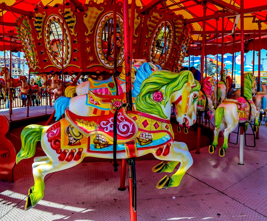 Colorful horses on the carousel at Coney Island. 