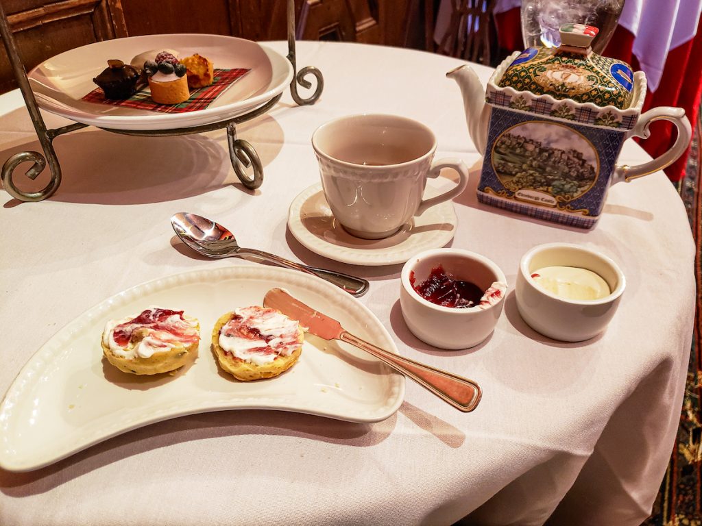 Afternoon tea with scones and a traditional tea pot in NYC. 