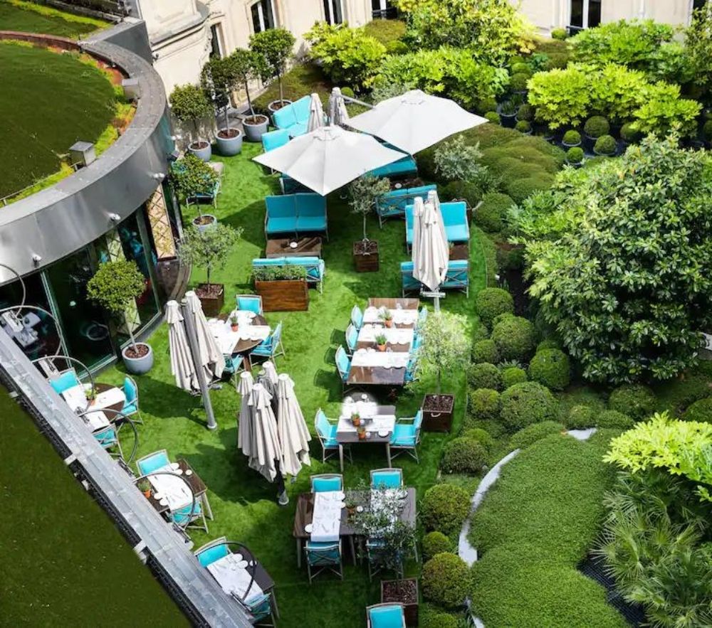 Aerial view of the outdoor patio at Hotel Barriere Le Fouquet’s, home to the best Paris afternoon tea. 
