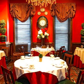 The red dining room of the king's carriage house, One of many great New York City date ideas.