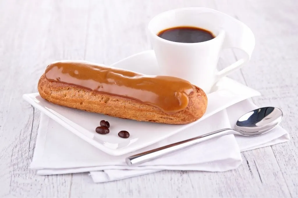 Caramel eclair with an espresso on the side. 