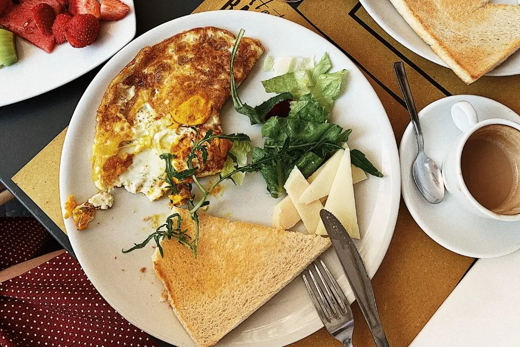 Omelet with toast and a salad from one of the best brunch spots in Vancouver. 