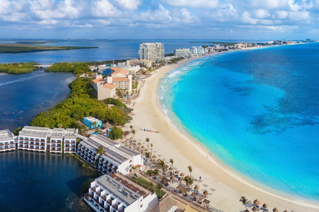 Aerial view of the awesome hotels and beaches in Cancun, the safest place to live in Mexico. 