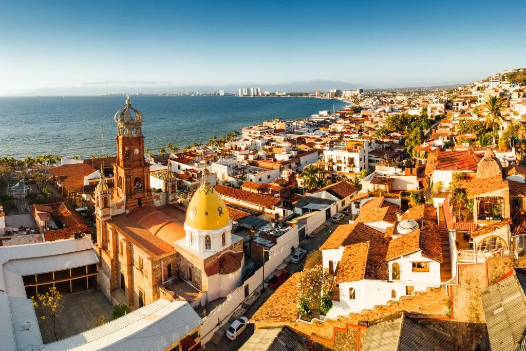 Aerial view of Puerto Vallarta along the coast, one of the safest places to visit in Mexico. 