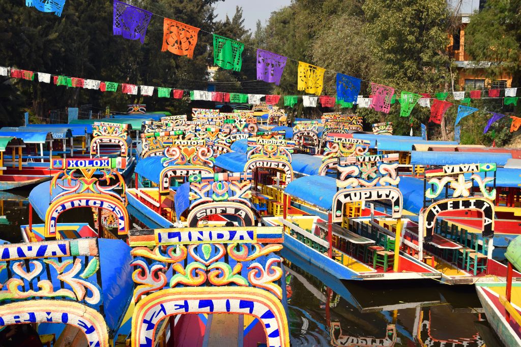 Vibrant and colorful boats on  Lake Xochimilco, one fo the best Mexico lakes ever. 
