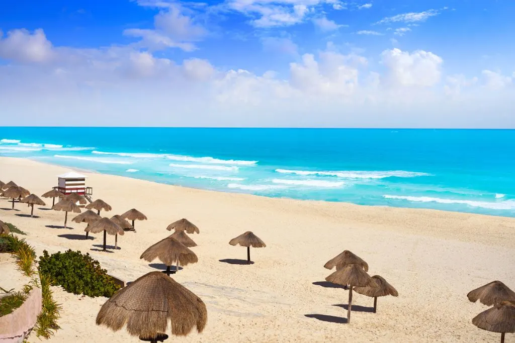 Thatched beach huts on playa del fines, one of the top beaches Cancun has.