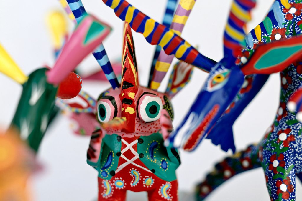 Colorful alebrijes that make for great Mexican souvenirs and that come in whimsical shapes and figures. 