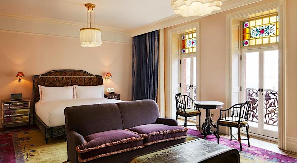 The hardwood bed and lavish furnishings of the Chelsea Hotel. One of the best boutique hotels in Chelsea New York. 