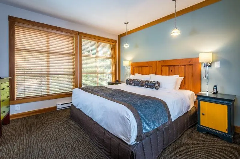 View of the spacious, comfy bed inside Legend Whistler. 