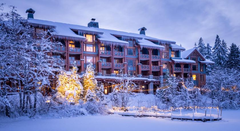 Nita Lake Mountain Lodge covered in snpw and lights in the winter and one of the best hotels in Whistler. 