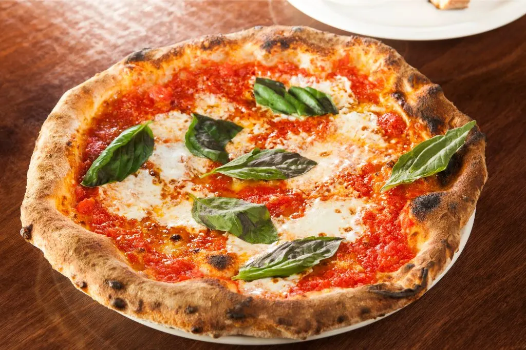 Pizza Margherita that you can enjoy during one of the best food tours in Naples. 
