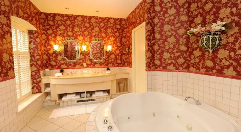 Tudor-style bathroom with a jacuzzi tub at the Old Mill Toronto Hotel. 