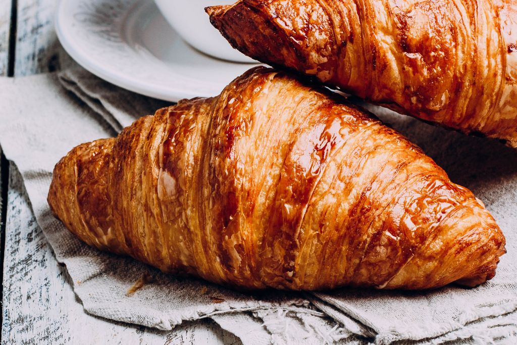 An up close shot of a croissant from one of the best bakeries in London. 
