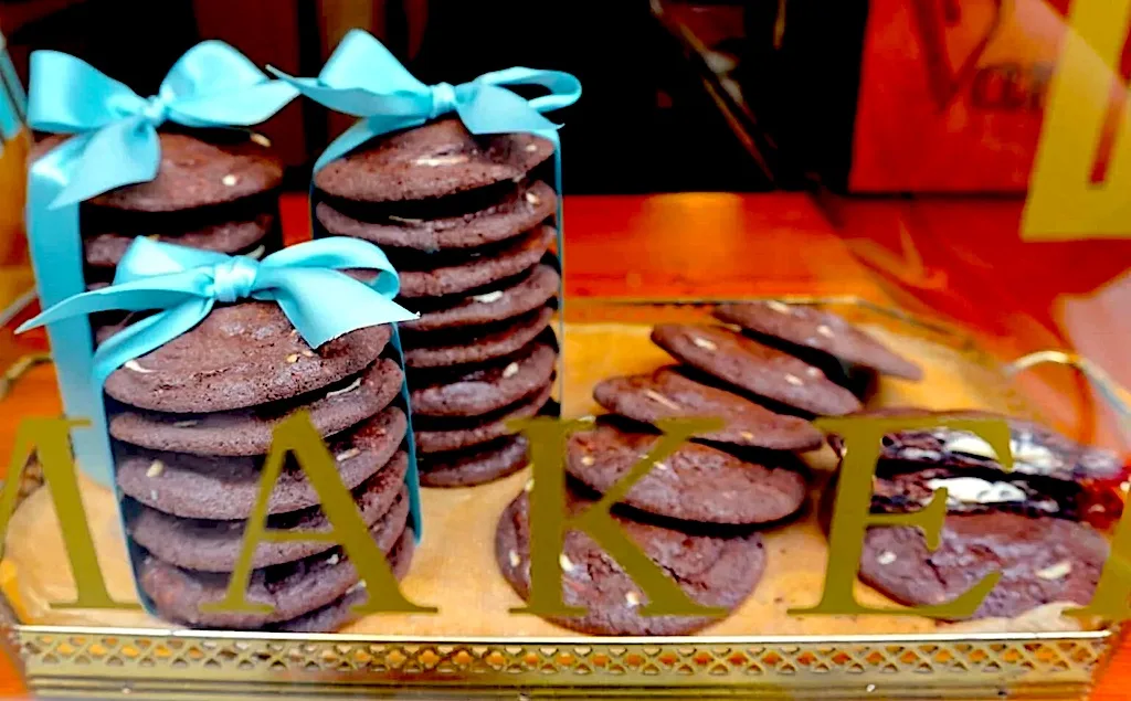 A view of the famous chocolate cookies all wrapped in stacks with a turquoise bow from Van Stepele. This is one of the best dessert places in Amsterdam.