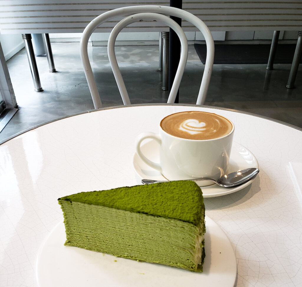 Green matcha crepe cake and coffee from one of the best Japanese cafes London has to offer.