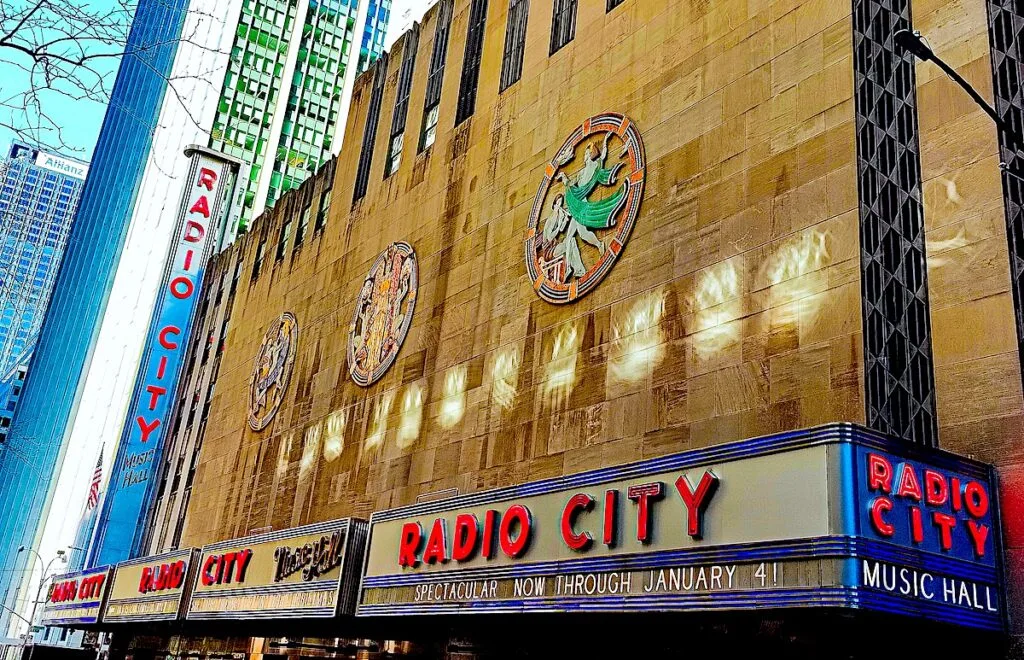 View of the famous red and blue sign that sits outside of Radio City Music Hall in NYC.